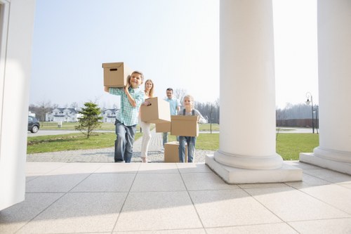 Van moving team preparing items safely before loading