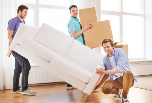 Packed boxes and household items ready for a moving truck
