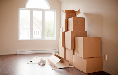 Furniture and boxes being prepared for transport by removal van