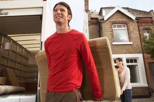 Furniture and boxes being safely loaded into a van