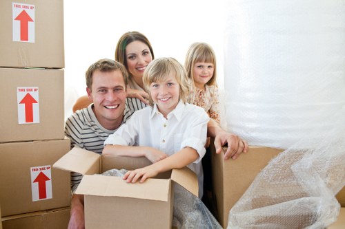 Professional movers carrying furniture from a flat in Pentonville