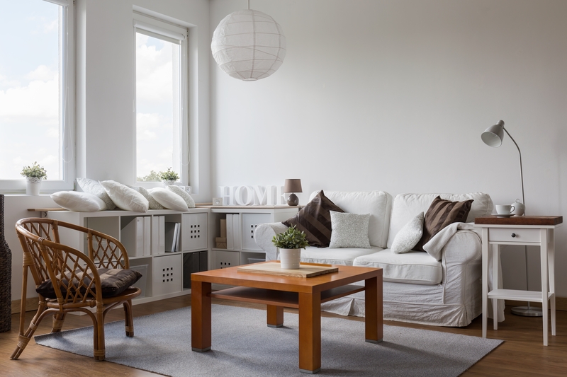 Professional movers carrying furniture with care and training